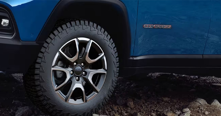 One of the 2025 Jeep Compass's tires near Henrietta, NY. 